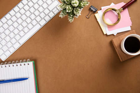 notepad with keyboard and coffee on paper backgroundの写真素材