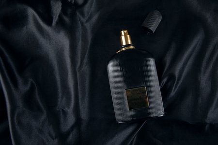 bottle of perfume on black background