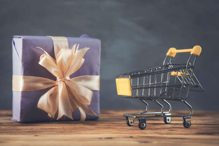 gift box and small basket on wooden table