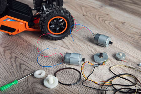 Small electric motors and toy car on table