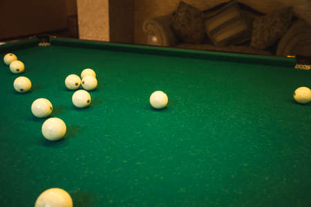 Sports game of billiards on a green cloth