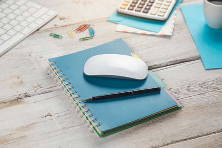 stationary and computer with coffee on the working table