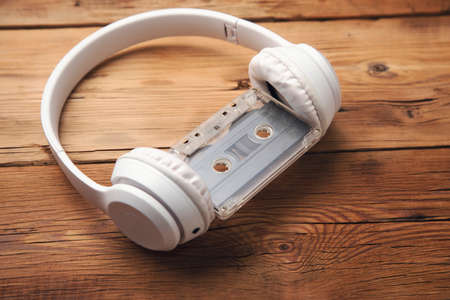 earphone and cassette on wooden tableの写真素材