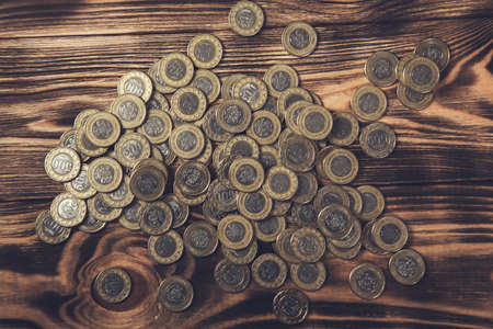 coins on the brown wooden background