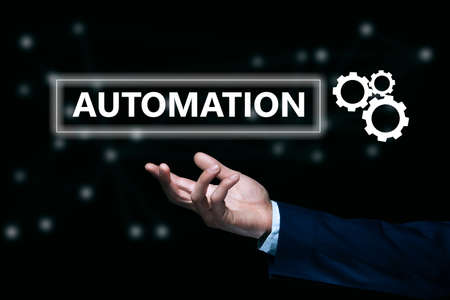 business man holding automation text in screen