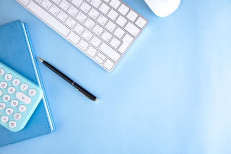 calculator on notebook with keyboard on the tableの写真素材