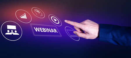 The business man pressing webinar buttonの写真素材