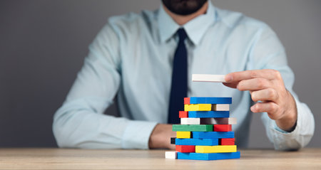 business man holding color wooden cube blockの写真素材