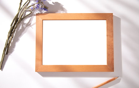 photo frame with lavender and pencil on tableの写真素材