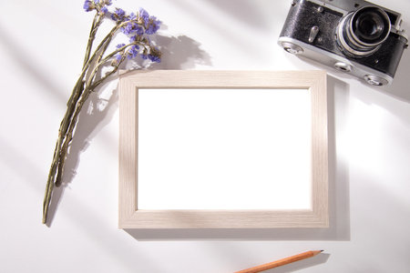 photo frame with lavender and camera on table