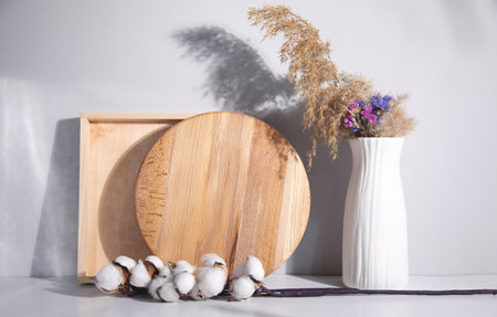 wood with a cotton branch and vase