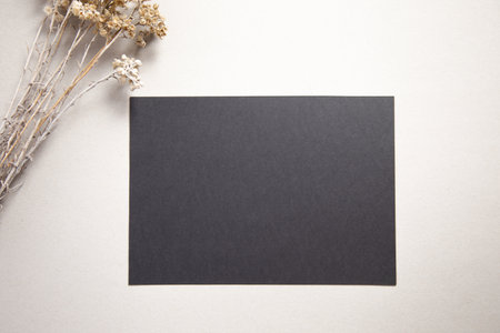 black paper with grass on the tableの写真素材