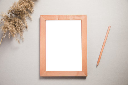 frame with decoration grass and pencil