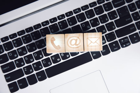 Internet symbol on a wooden cube on a computer keyboardの写真素材