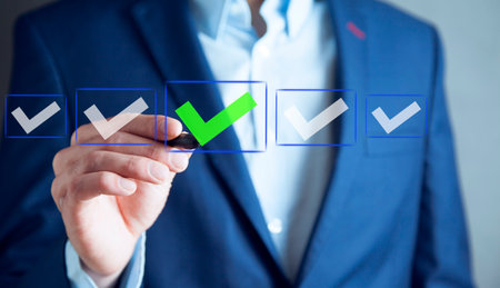 business man with check mark on virtual screenの写真素材