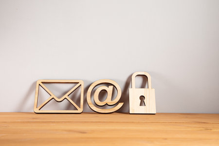 wooden lock with letter and mail sign on tableの写真素材