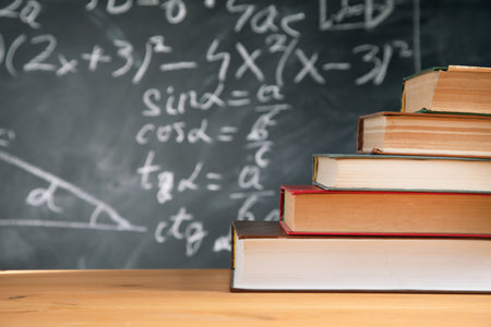 Education concept - books on the desk in the auditoriumの写真素材
