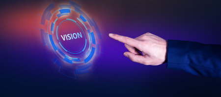 Vision concept, man touching vision text in the screen
