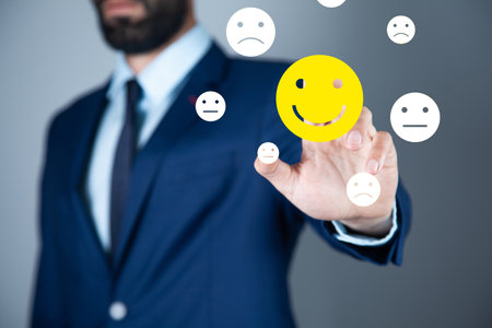 business man holding smiling face iconsの写真素材