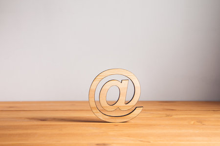 wooden email sign on the wooden background
