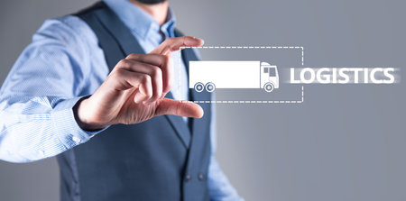 Business man holding logistics truck icon.の写真素材