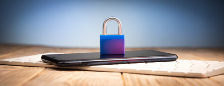 lock on phone on computer keyboardの写真素材