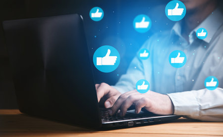 Hand of businessman using laptop with icon social media and social network. online marketing conceptの写真素材