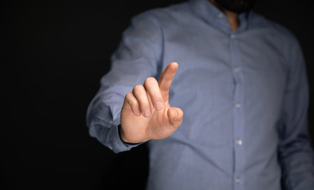 Businessman hand touching virtual screen, modern background concept
