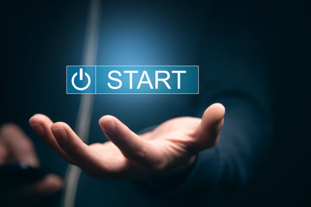 man holding smart phone with start icon