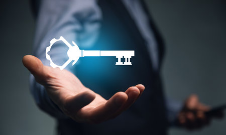 man holding smart phone with key iconの写真素材