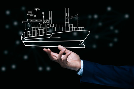 business man holding ship icon on dark background