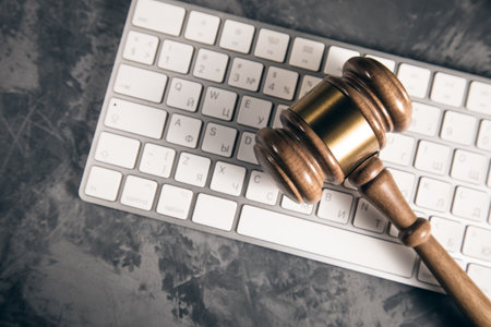 Judge gavel with computer keyboard. Concept of internet crimeの写真素材
