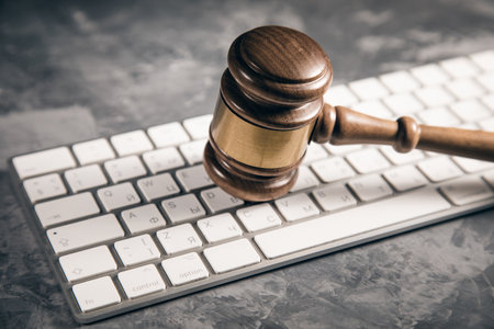 Judge gavel with computer keyboard. Concept of internet crimeの写真素材
