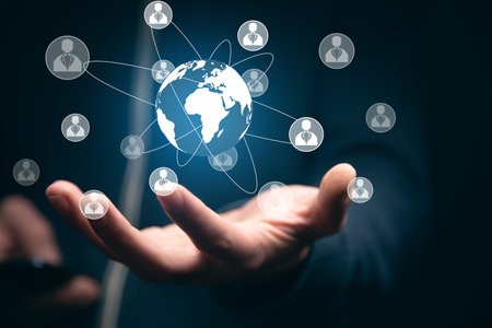 man holding smart phone with global and social networkの写真素材