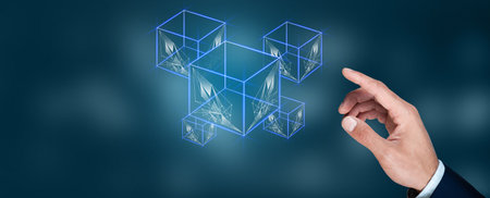 Business man touching displaying cube symbolsの写真素材