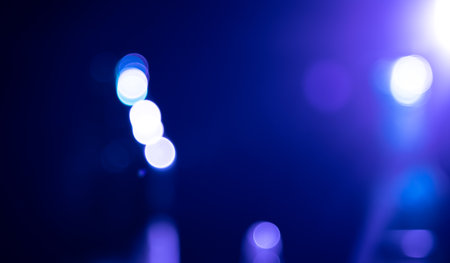 Dark blue abstract backgrounds with bokeh.