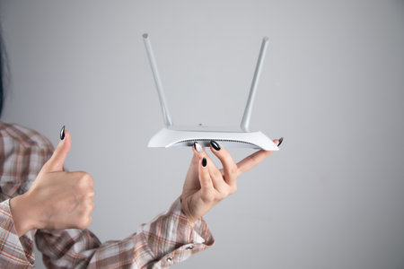 wifi router on female hand with okay sig