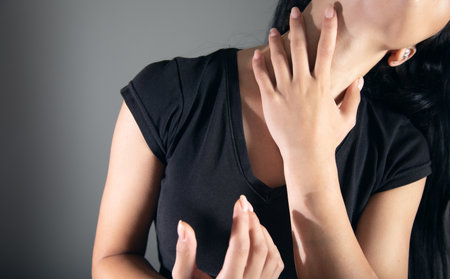 Young woman suffering from neck pain.の写真素材