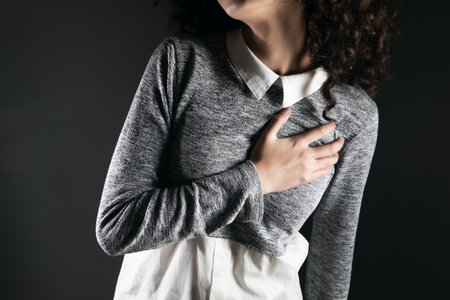 heart attack, woman hand in ache heartの写真素材