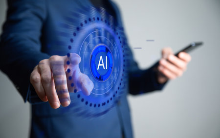 business man holding phone with AI icon.の写真素材