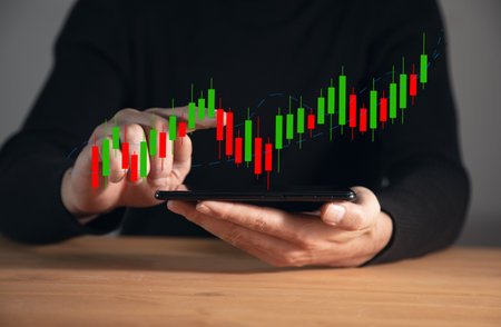business man holding phone with stock exchange