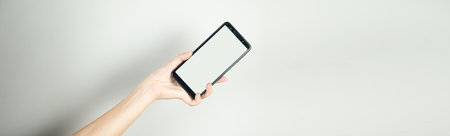 Hand Holding Mobile Cell Phone Close Up