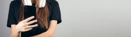 young woman listening to music with earphones.の写真素材