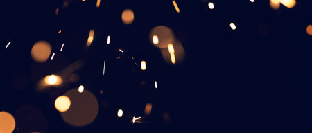 background of abstract glitter lights. gold, blue and black. de focused