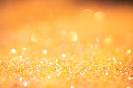 background of abstract glitter yellow lights, de focusedの写真素材