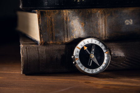 compass with vintage books on the tableの写真素材