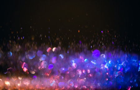 background of abstract glitter lights. purple and blue. de focused