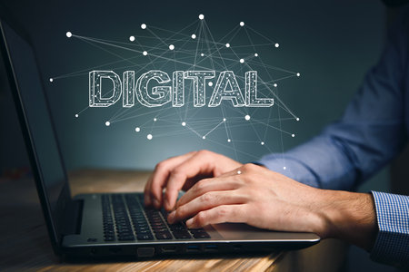 business man working in computer with digital text in screenの写真素材