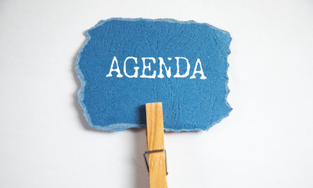 agenda text on paper with clamp on tableの写真素材
