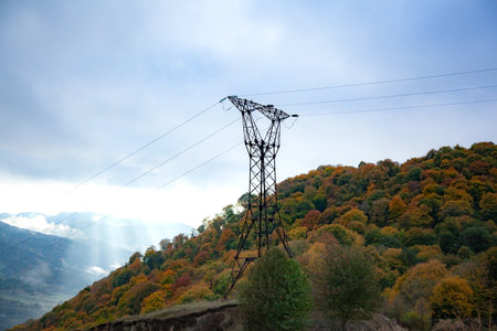High voltage post, High voltage tower sky background on the mountain forest